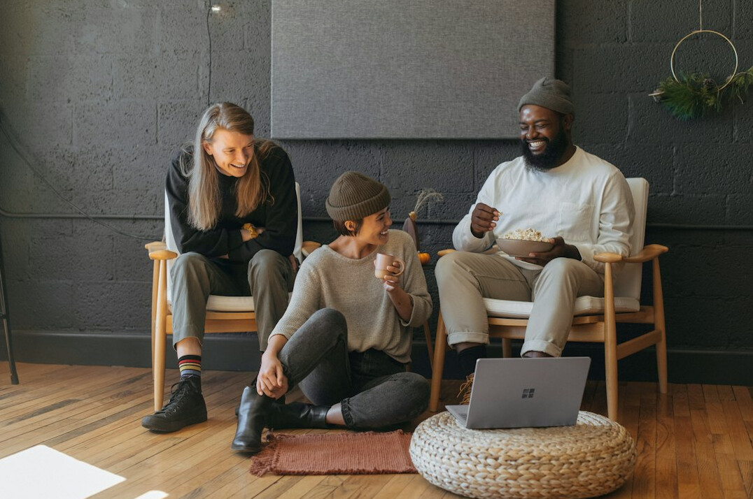 group of friends using digital devices