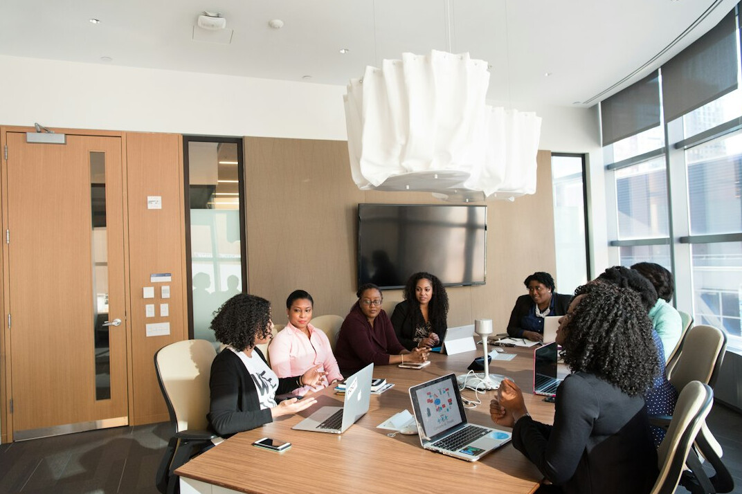 colleagues in office meeting