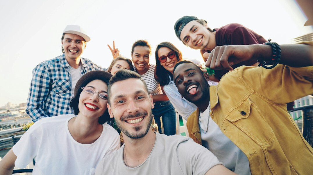 diverse group smiling outdoors